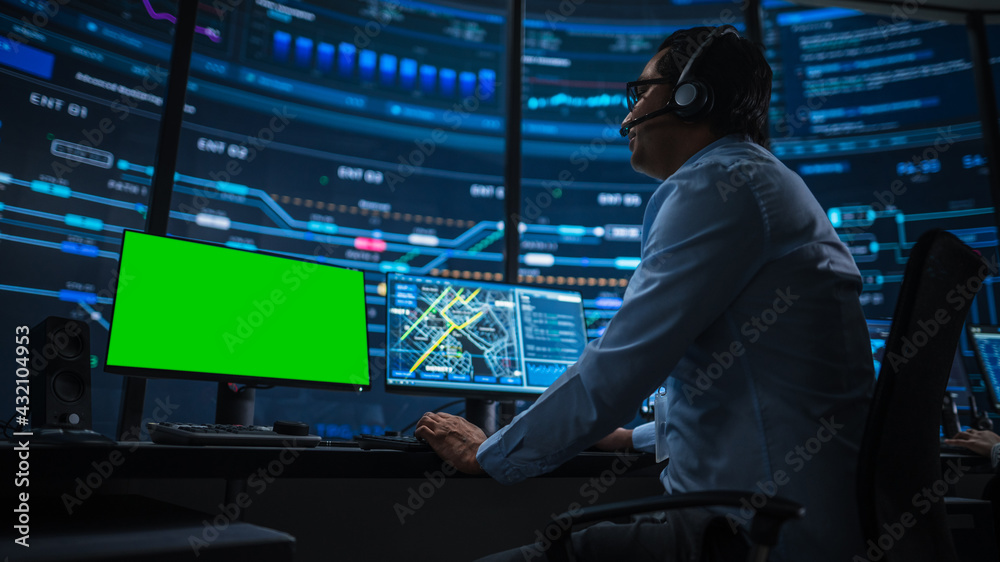 Aufkleber Professional IT Technical Support Specialist and Software Developer Working on Computer with Green Screen Mock Up Display in Monitoring Control Room with Digital Screens. Low Angle Shot.