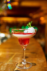 Panna Cotta with sweet souce and fresh mint in a glass. Close-up, selective focus