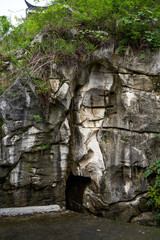 Partial close-up of stone mountain peaks and green vegetation in Guilin, Guangxi