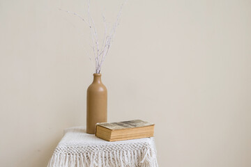 Fototapeta na wymiar White branches in ceramic vase