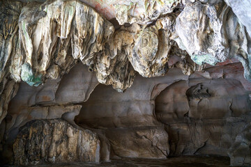 Close-up of stalactites in a cave in a valley
