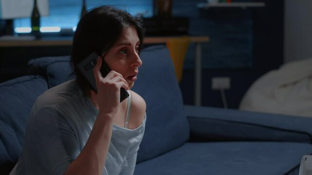 Shocked alone woman listening phone call, receving tragic news dropping smartphone feeling emotionally unstable, scared, lonely desperate, vulnerable. Traumatised person suffering from chronic disease