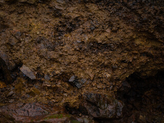 Black rock, stone, textured. Background for design. Hard light.