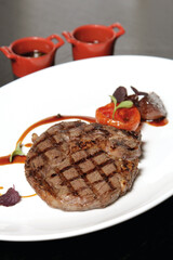 Beef steak on a white plate