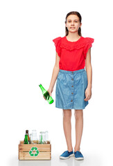 recycling, waste sorting and sustainability concept - smiling girl with glass bottles and jars in wooden box over white background