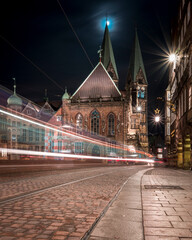 The Bremer Dom at night with the moon and a tram - obrazy, fototapety, plakaty