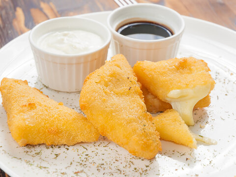 Fried Breaded Cheese With Barbecue Sauce And Sour Cream