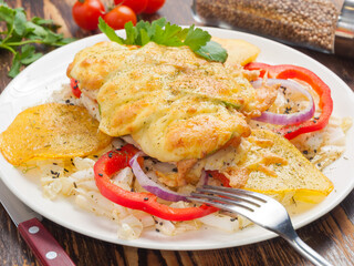 chicken fillet baked with cheese and vegetables. Concept: fast satisfying food