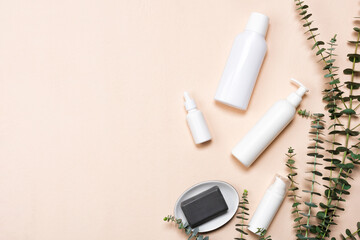 Bottles of essence or serum with natural eucalyptus leaves