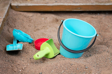 Sandbox toys (bucket and spades) for outdoor play in the sand