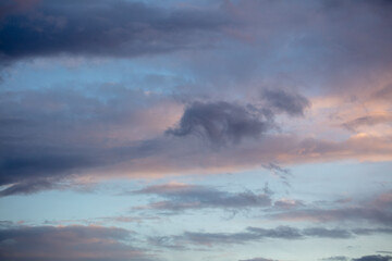 Rain clouds in the sky at sunset