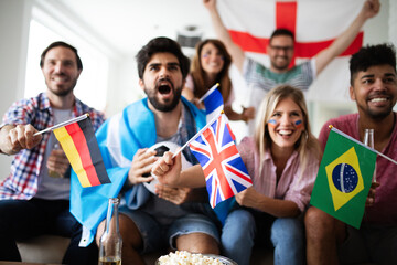 Young group of friends watching sport on television