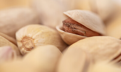 Close-up of fresh pistachio nuts as background.