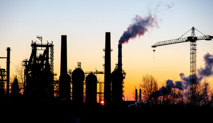 The pipes of the plant at sunset