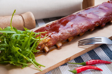 tasty whole pork ribs with barbecue sauce