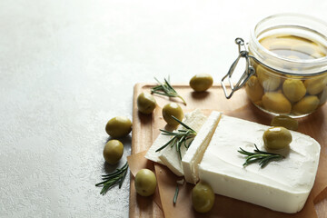 Concept of tasty food with feta cheese on white textured background