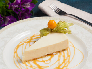 cheesecake decorated with physalis, caramel and flowers