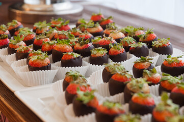 chocolate-covered strawberries at the reception. close up. selected focus