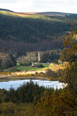 Photograph of the Glendalough Round Tower from afar in Wicklow Ireland