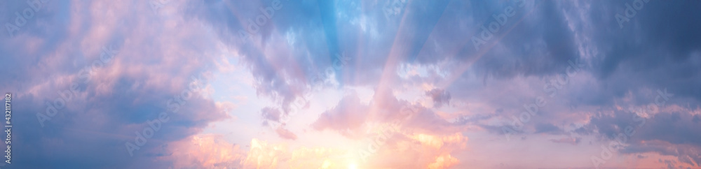 Wall mural panorama of cloudy sky with pink clouds and sun