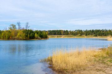 Spring landscape with Saxtorps lake on the Swedish west coast. Nature reserve popular for hiking with family and friends.