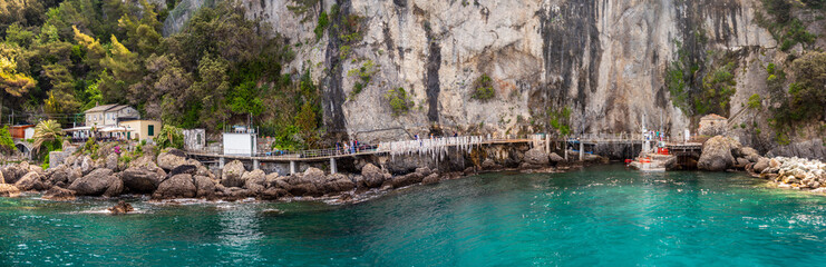 beautiful rocky berth of Punta Chiappa near Portofino in Liguria with sea walkway horizontal italy background