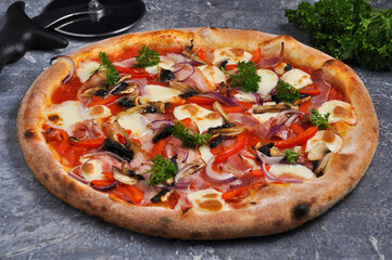 pizza with bacon, sweet peppers, mushrooms, onions and mozzarella cheese