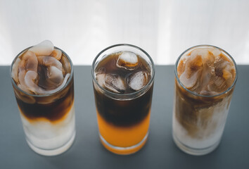 top view of three glasses of different iced coffee