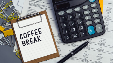The words Coffee Break written on a white notebook. Work and study concept
