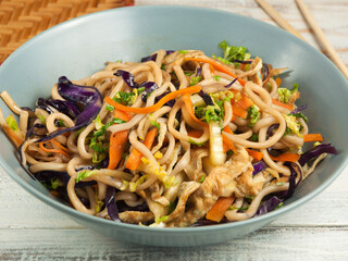 wheat noodles with vegetables and omelet. Asian cuisine