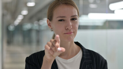 Assertive Young Businesswoman with Pointing with Finger