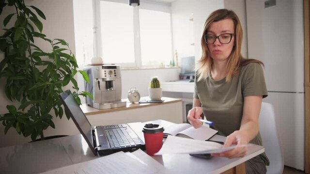Freelancer woman works at laptop