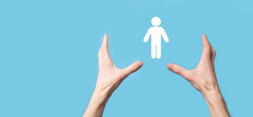 Male hand holding human icon on blue background. Human Resources HR management Recruitment Employment Headhunting Concept.Select team leader concept. Male hand click on man icon.Banner ,copy spase.