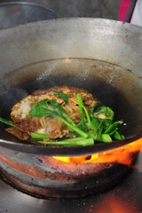 Stir-fried rice noodle with black soy sauce and pork and kale - Asian food style
