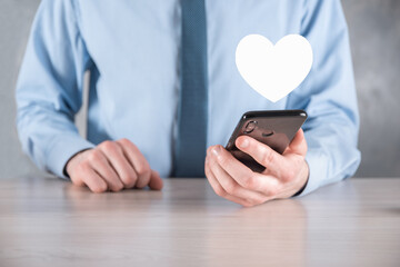 Businessman in shirt holding heart icon symbol