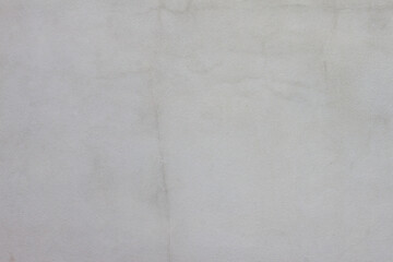 Cement wall of the house with cracks and stain for background and textures.