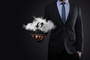 Cloud technology. Polygonal wireframe cloud storage sign with two arrows up and down on dark ....