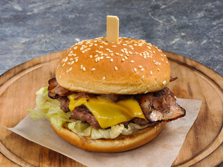Burger with beef, cheese, bacon and lettuce
