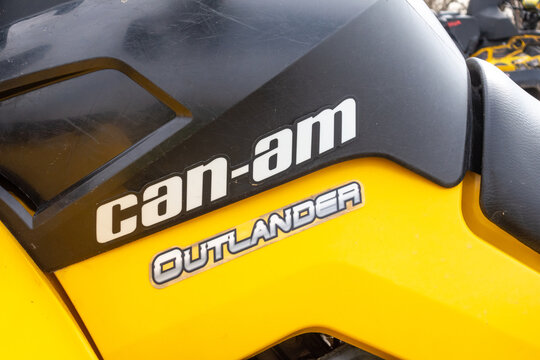 Afipsip, Russia - October 31, 2020: BRP Can Am Outlander logo on yellow black quad bike at Mud Racing contest. ATV SSV motobike competitions are popular extreme sport and outdoor activity.