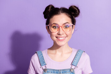 Photo of adorable satisfied lady toothy smile look camera wear glasses isolated on violet color...