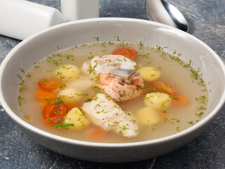 rich fish soup with salmon and pike perch, potatoes and carrots