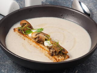 cream of porcini mushroom soup. Beautiful serving in a restaurant