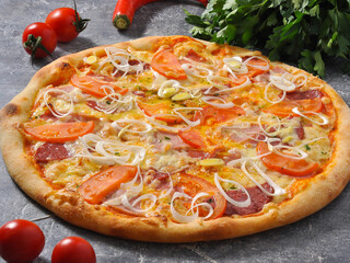 pizza with meat bacon, sausage, tomatoes and cheese