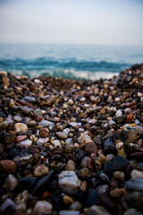 
colorful beach stones with sea background