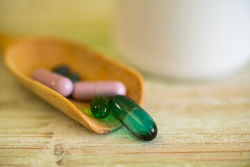 Medical supplies for treating various diseases on wooden backgrounds, patterns and colors