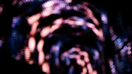 Pink and violet bokeh on a dark background. © supaleka