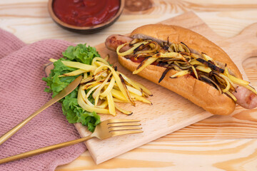 hot dog with potatoes and chips