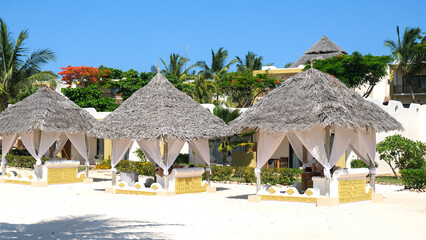 Fototapeta na wymiar Cabana on the beach. Luxury life. Sunny holidays on Zanzibar coast.