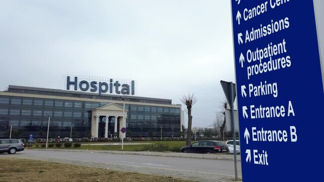 Direction sign of main entrance of modern hospital building