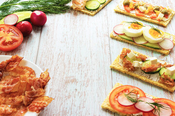 Ready snacks with correct food with ingredients on a wooden light background with place for text